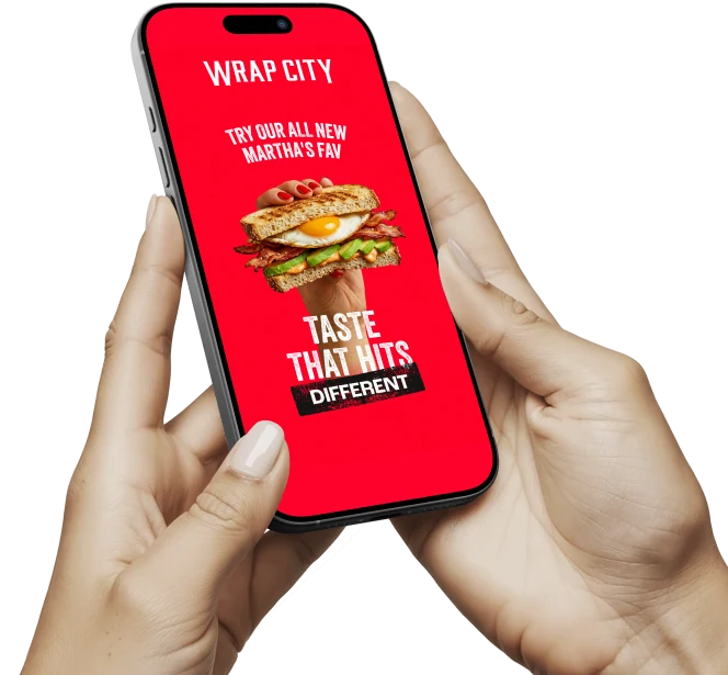 The Wrap City app held in two hands