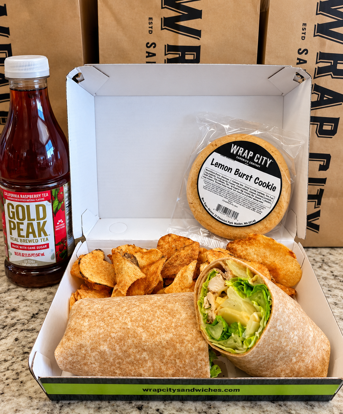 An assortment of Wrap City wraps and sandwiches packed for a crowd