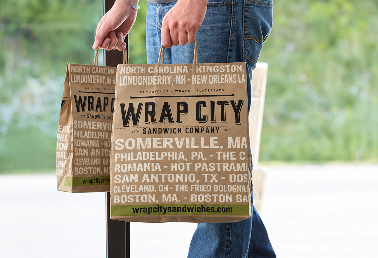 Coworkers sharing Wrap City boxes at a meeting